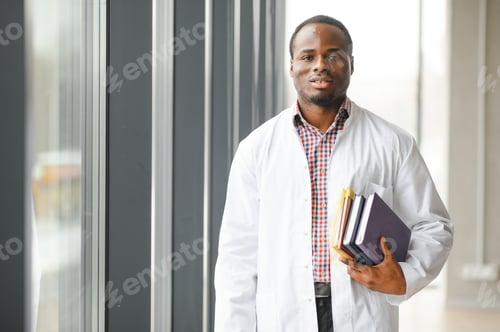 Preview: Medical Professional in White Coat Holding Books
