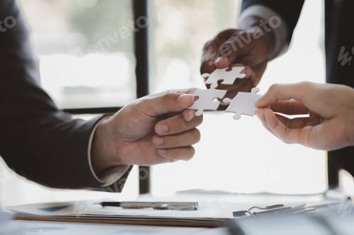Preview: Group business people holding jigsaw puzzle together.