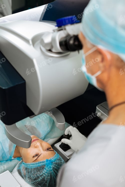 Preview: Nice adult woman having her eyes examined by the doctor