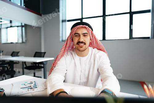 Preview: Young successful arab businessman working in the office