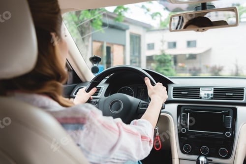 Preview: partial view of woman driving car alone