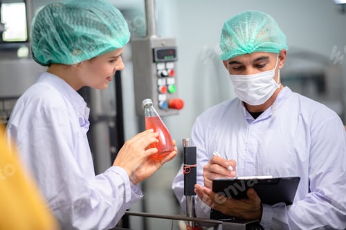 Preview: food technician control checking production line of water drink in manufacturing factory