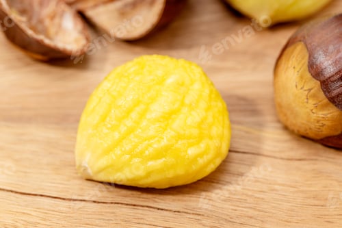 Preview: Cooked and Peeled sweet chestnut on wooden table