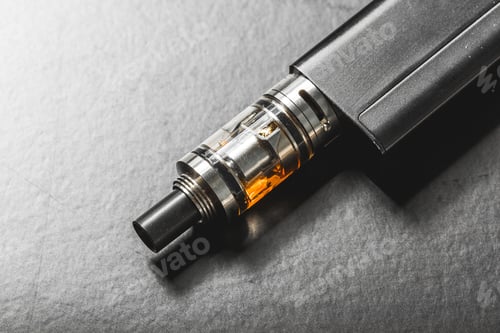 Preview: The most popelar modern electronic cigarette over black background. Vape. Vapor.