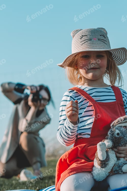 Preview: woman photographer taking pictures of a girl, work, woman professional, work in the shadow of the ca
