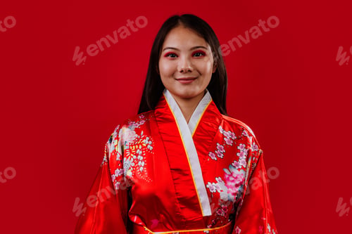 Preview: Young asian woman wearing traditional floral kimono smiling