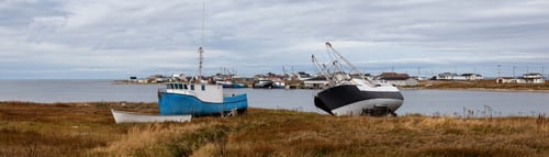 Preview: Scenic view on the small town on the Atlantic Ocean shore with boats parked onshore