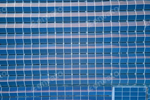 Preview: Aerial view of solar power plant with blue photovoltaic panels