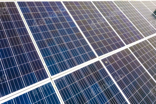 Preview: Close-up surface of blue shiny solar photo voltaic panels system on building roof.