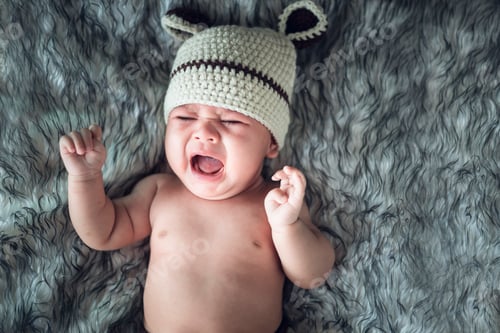 Preview: Baby girl crying in a wrap