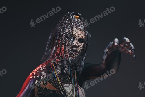 Preview: Scary African shaman with a petrified cracked skin and dreadlocks. Make-up concept.