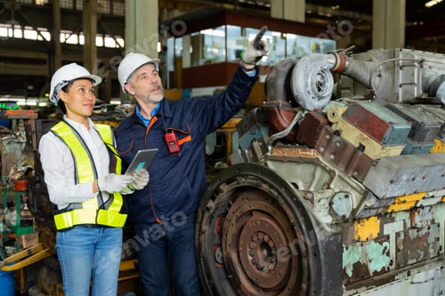 Preview: A business man inspects the work of an on-site worker