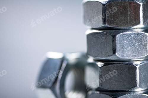 Preview: Working tool. Metal nuts on the table.