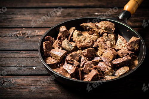 Preview: Liver fried in a frying pan.