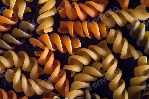 Preview: close-up shot of colored spiral shape pasta