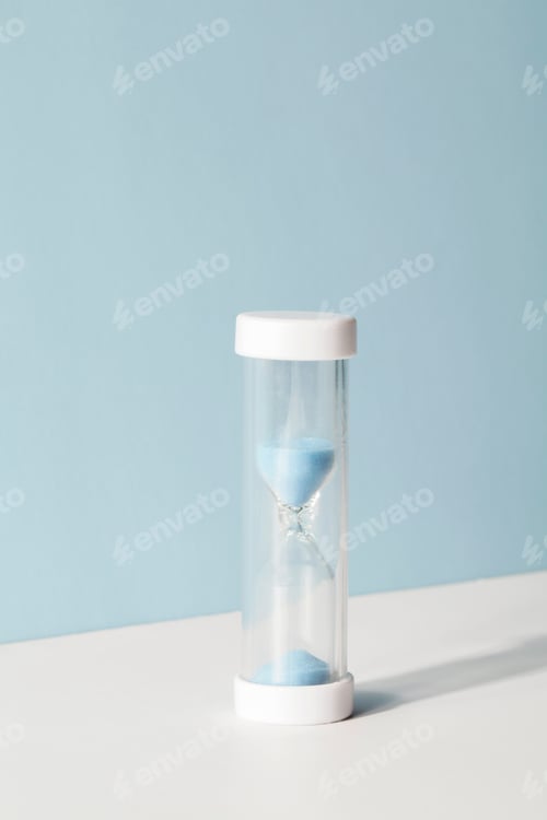 Preview: hourglass on blue and white background with shadow. concept of decision making and deadline.