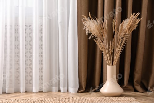 Preview: Fluffy reed plumes near window indoors, space for text. Interior element