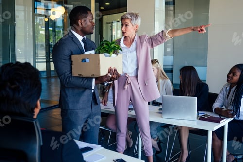 Preview: Dissatisfied senior short haircut boss scolding employees for bad work at diverse group
