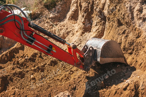 Preview: Excavator shovel digging on dirt