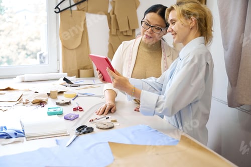 Preview: Female fashion designers use a tablet in a work environment