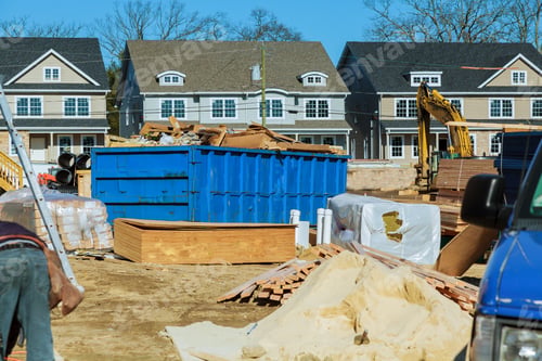 Preview: Industrial garbage bin blue construction debris container filled with rock and concrete rubble.
