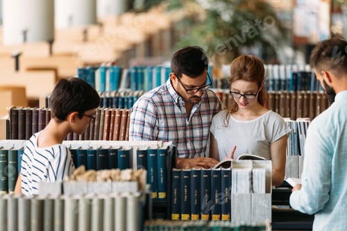 Preview: Young attractive students spending time in library
