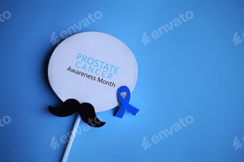 Preview: Mustache and blue ribbon with text PROSTATE CANCER AWARENESS MONTH.
