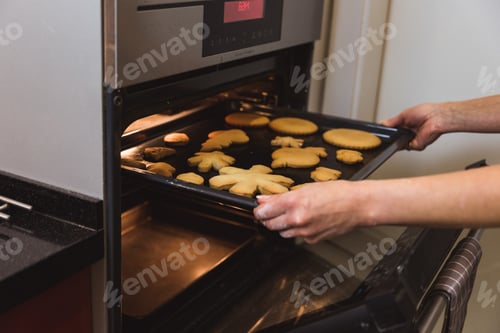 Preview: Woman bake gingerbread cookies