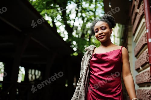 Preview: Black model in red silk dress.