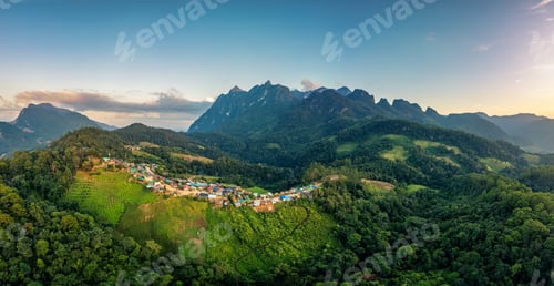Preview: Aerial view of Doi Luang Chiang Dao limestone mountain over tribe village on hill in the evening