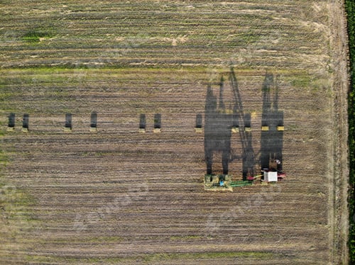 Preview: Green Agricultural fields, people working with machinery