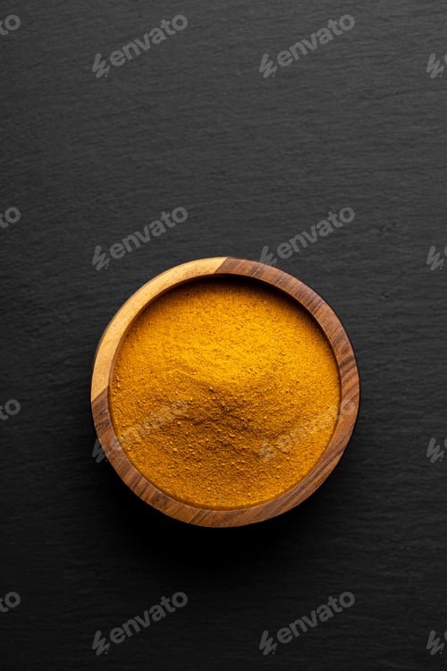 Preview: Wooden Spoons with Turmeric Powder on Slate Background – Natural Cooking Ingredients