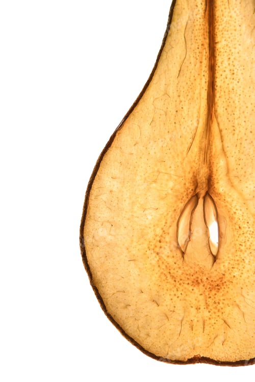 Preview: Without sugar. Dried pear on a white background. Slices to the light. Frips. Natural food.