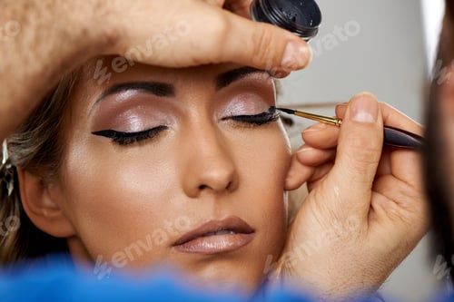 Preview: Professional Makeup Artist Applying Shadow To Her Eyelid