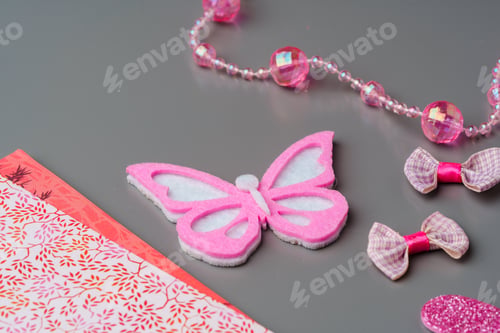 Preview: Crafting materials and tools arranged on a gray surface during a creative project