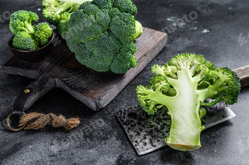 Preview: Sliced organic Raw green broccoli cabbage. Black background. Top view
