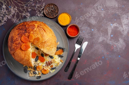 Preview: top view delicious shakh plov with raisins and seasonings on the dark background rice dough cooking