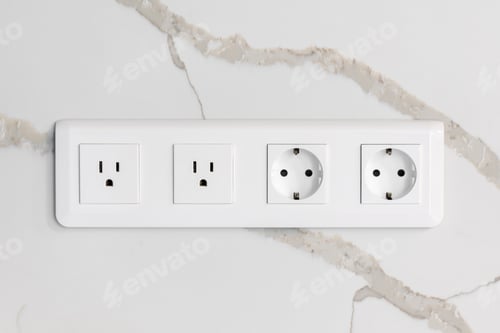 Preview: Modern wall outlets. Euro and US standards. Marble background.