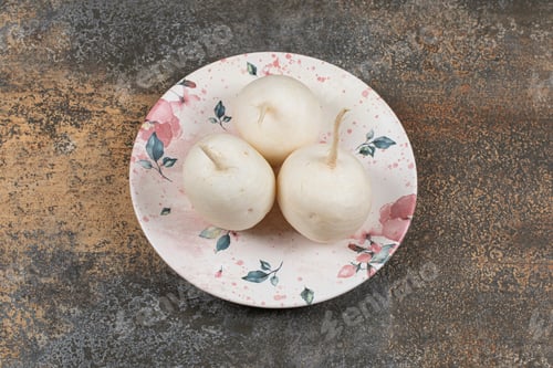 Preview: Three radish on the plate , on the marble background