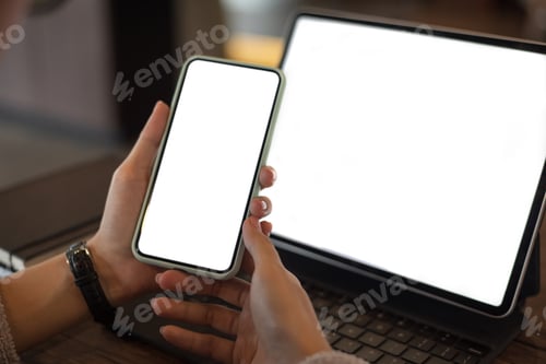 Preview: Mock up. image of woman holding mobile phone with blank white screen.