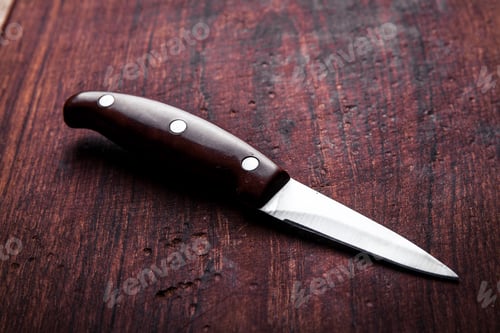 Preview: Brown knife on an old kitchen. Cooking, cutting, cooking. On wooden background