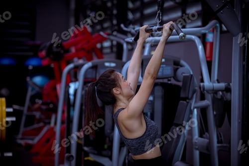 Preview: Sport fitness athlete woman with sportwear training weightness equipment at gym for bodybuilding hea