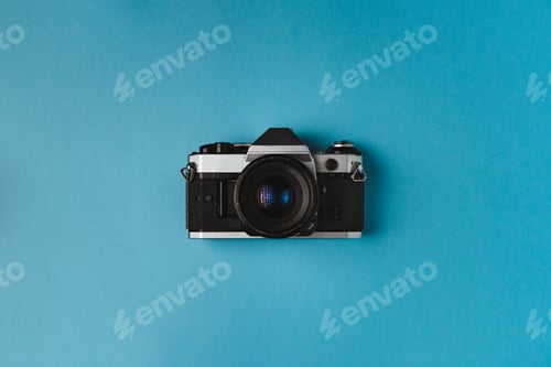 Preview: Retro film camera on blue background