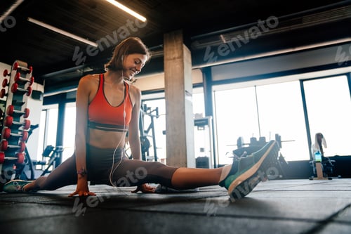 Preview: Fitness, sport, training and lifestyle concept. Smiling woman stretching in gym