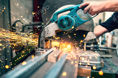 Preview: industrial worker using a compound mitre saw with circular blade