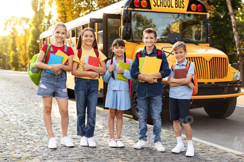 Preview: Back To School. Multiethnic Group Of Children Posing Outdoors Near School Bus