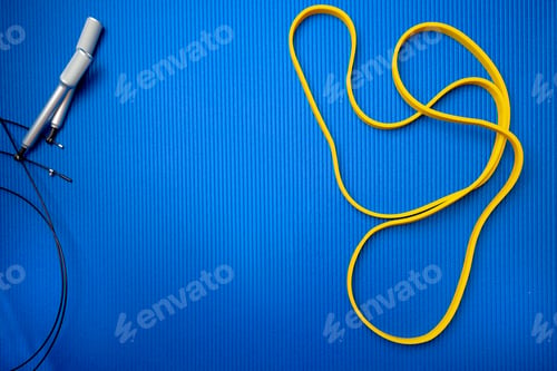 Preview: Jumping rope on blue mat background in a gym