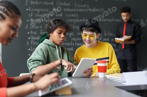 Preview: Students working on tablet pc at school