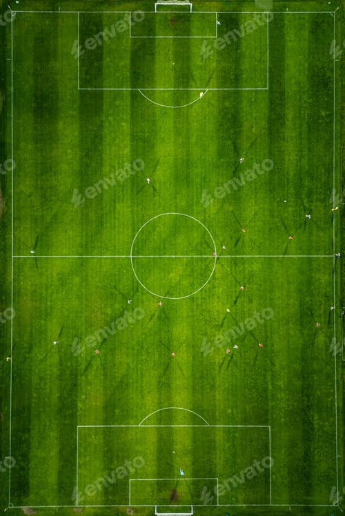 Preview: Aerial view of a soccer field in action, with players running, passing, and scoring goals.