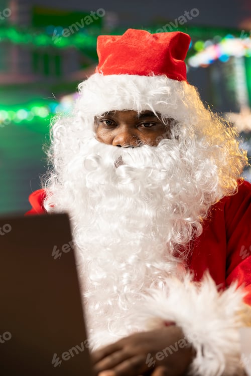 Preview: Father Christmas is navigating the web checking on children wish lists